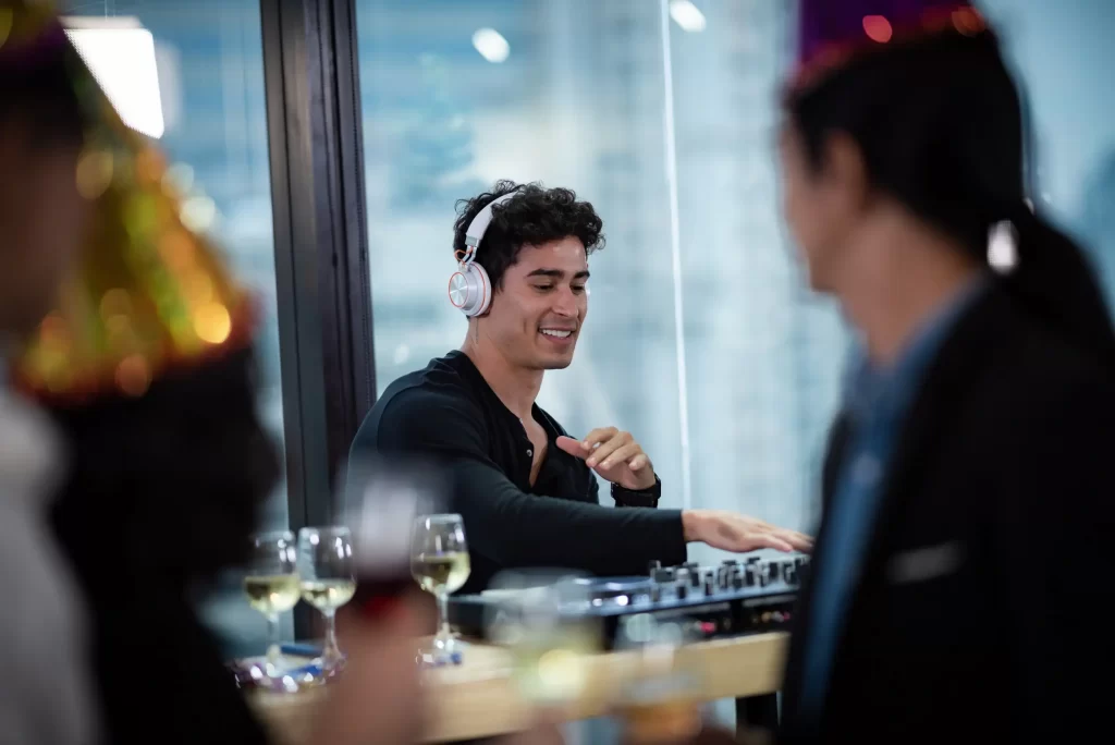 A restaurant mixing music on a soundboard, creating a lively dining atmosphere.